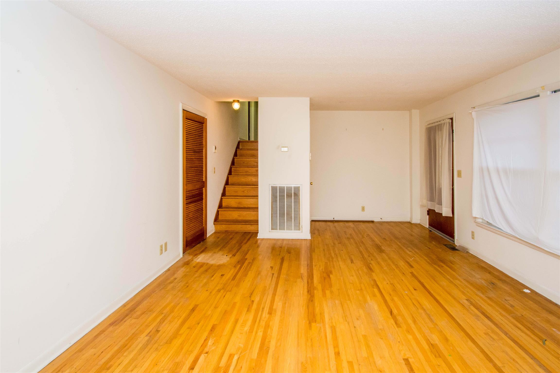 319 Notgrass Road Clarksville, TN 37042 - Photo 3 of 15 a view of a room with wooden floor and stairs