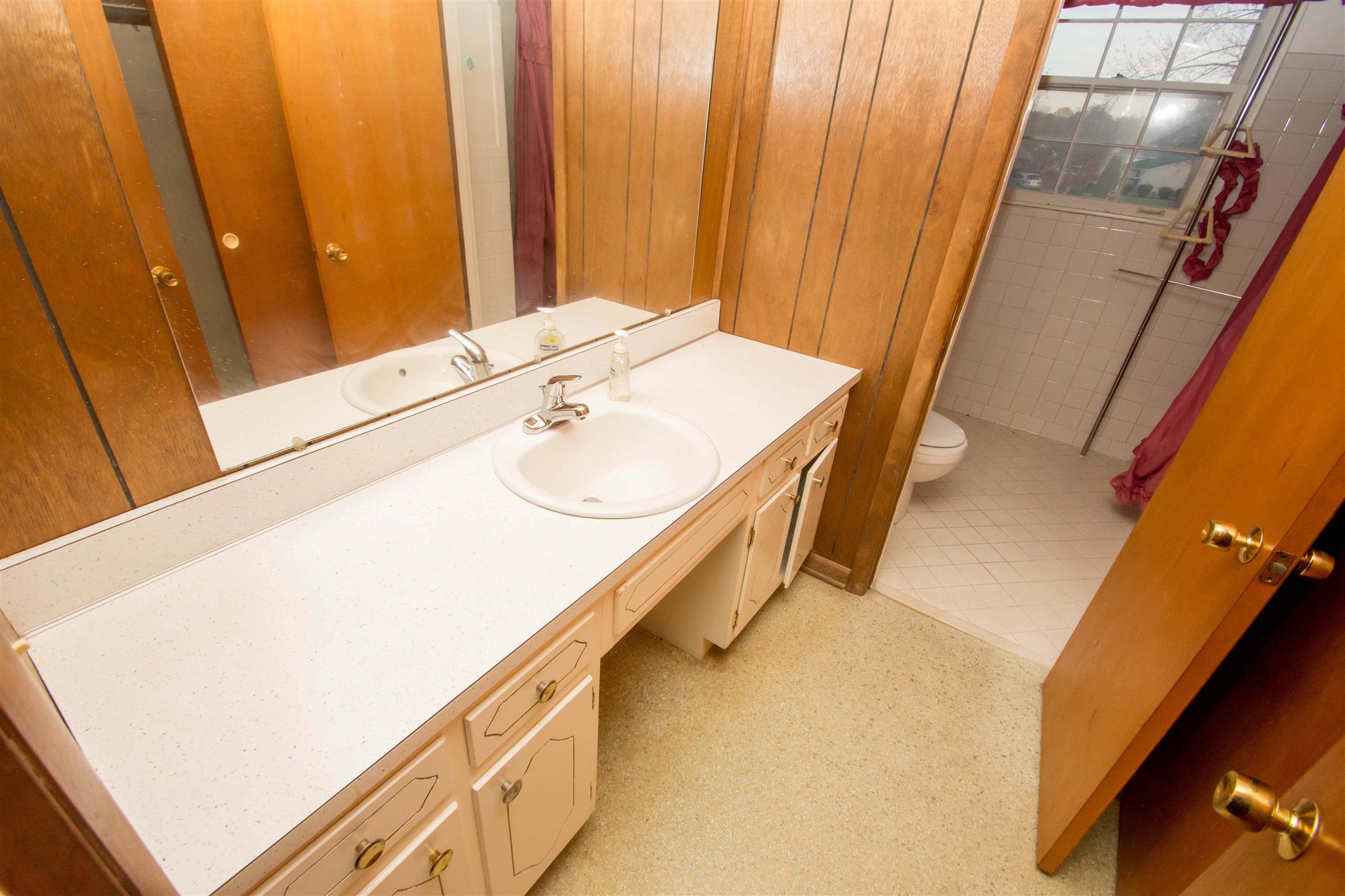 319 Notgrass Road Clarksville, TN 37042 - Photo 8 of 15 a bathroom with a sink and a mirror