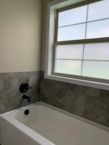 a bathroom with a bathtub