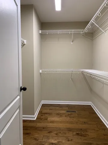 a view of an empty walk in closet