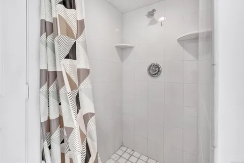 a bedroom with a large bed and a couch