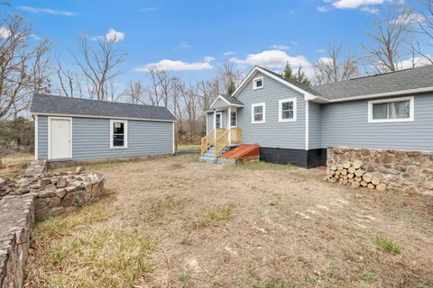a view of a backyard of a house