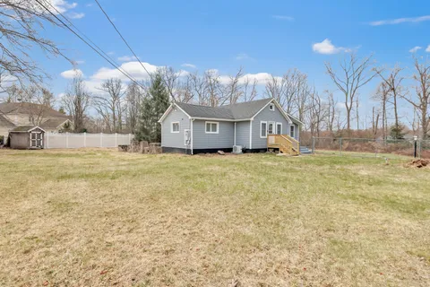 a view of a house with a yard