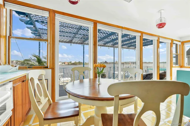 a bathroom with a granite countertop sink and a toilet