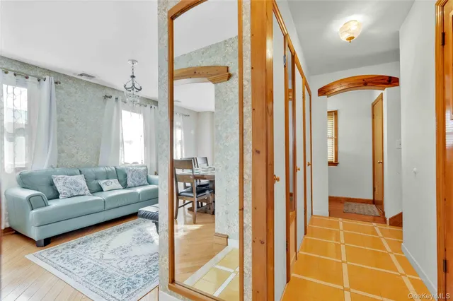 a view of a balcony with wooden benches