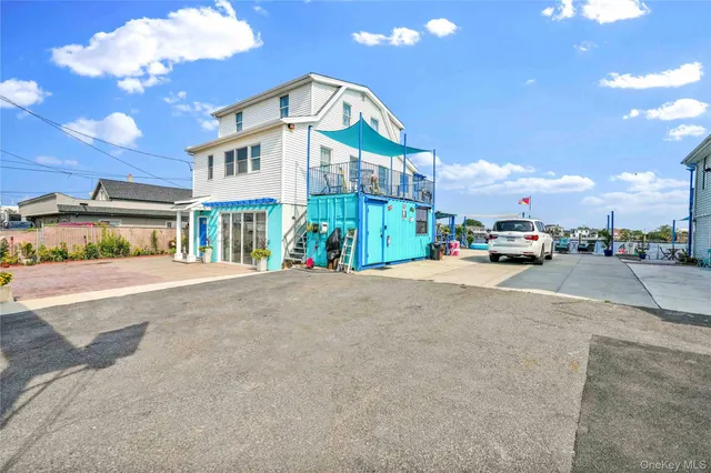 a view of a dining room with furniture and a chandelier