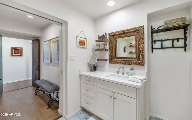 a bathroom with a sink and a mirror