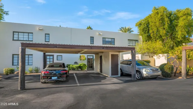 a view of backyard with outdoor seating and green space