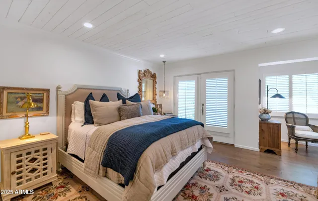 a bed room with a bed and furniture