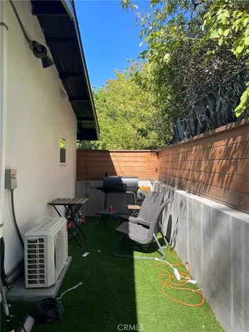 a view of backyard with seating space
