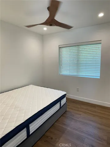 a room with a bed and a window