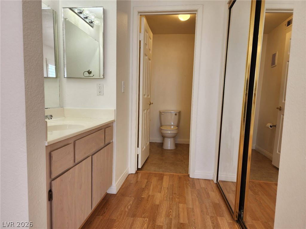 231 West Horizon Ridge Parkway, Unit 1127 Henderson, NV 89012 - Photo 25 of 39 A compact bathroom offers a vanity with ample storage and a private water closet.