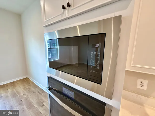 a kitchen with a stove and a microwave