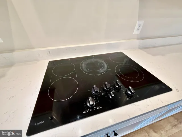 a kitchen with stainless steel appliances white cabinets and a sink