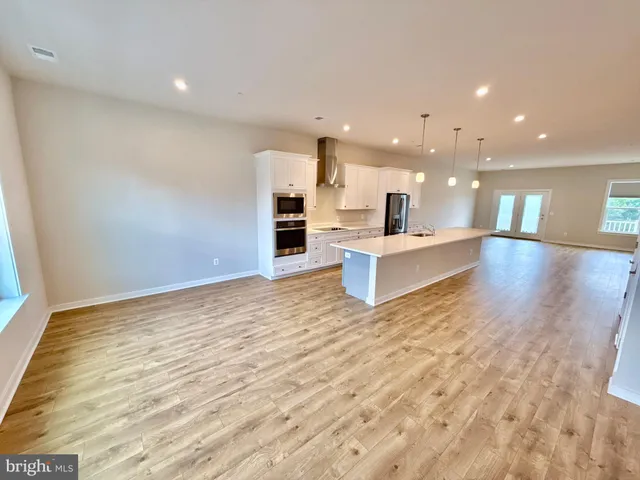a view of balcony with wooden floor