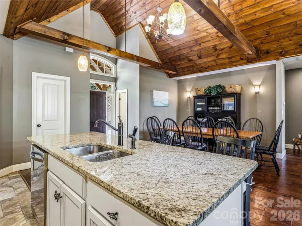 a kitchen with stainless steel appliances granite countertop a stove and cabinets