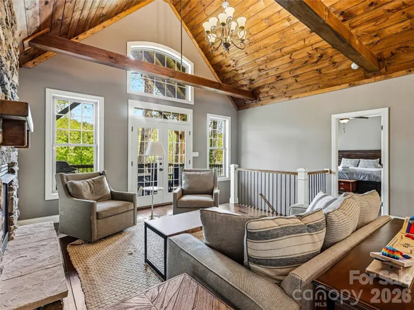 a bedroom with a bed rug and window