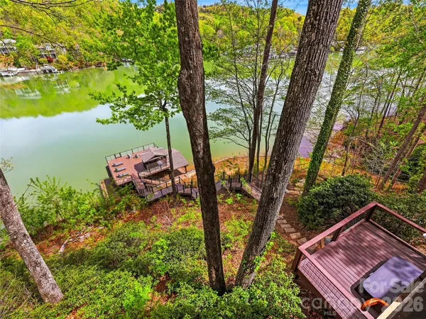a view of a balcony with couches wooden floor