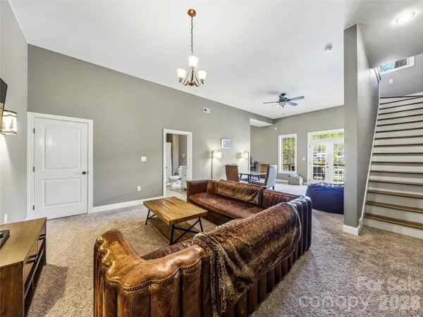 a view of a room with furniture and wooden floor