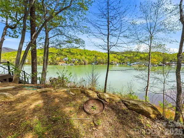 a view of a chairs and table on the deck