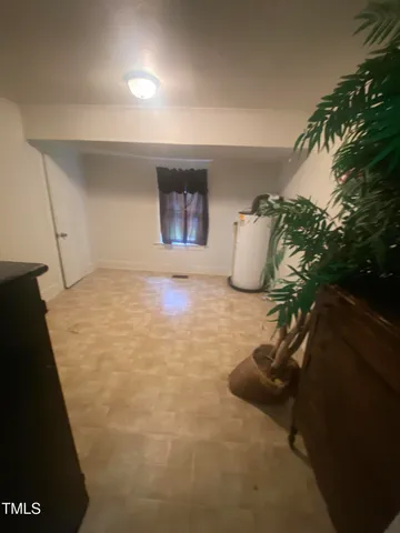 a view of room with furniture and wooden floor