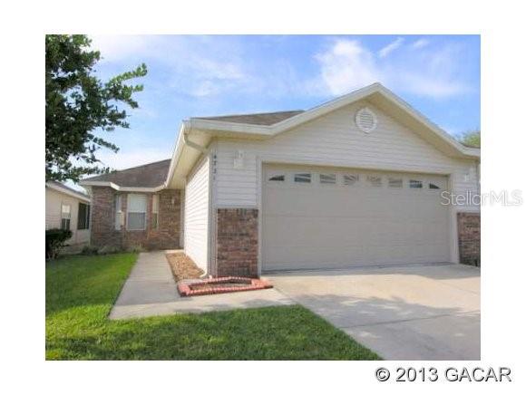 4721 Northwest 78 Road Gainesville, FL 32653 - Photo 1 of 1 a house view with a garden