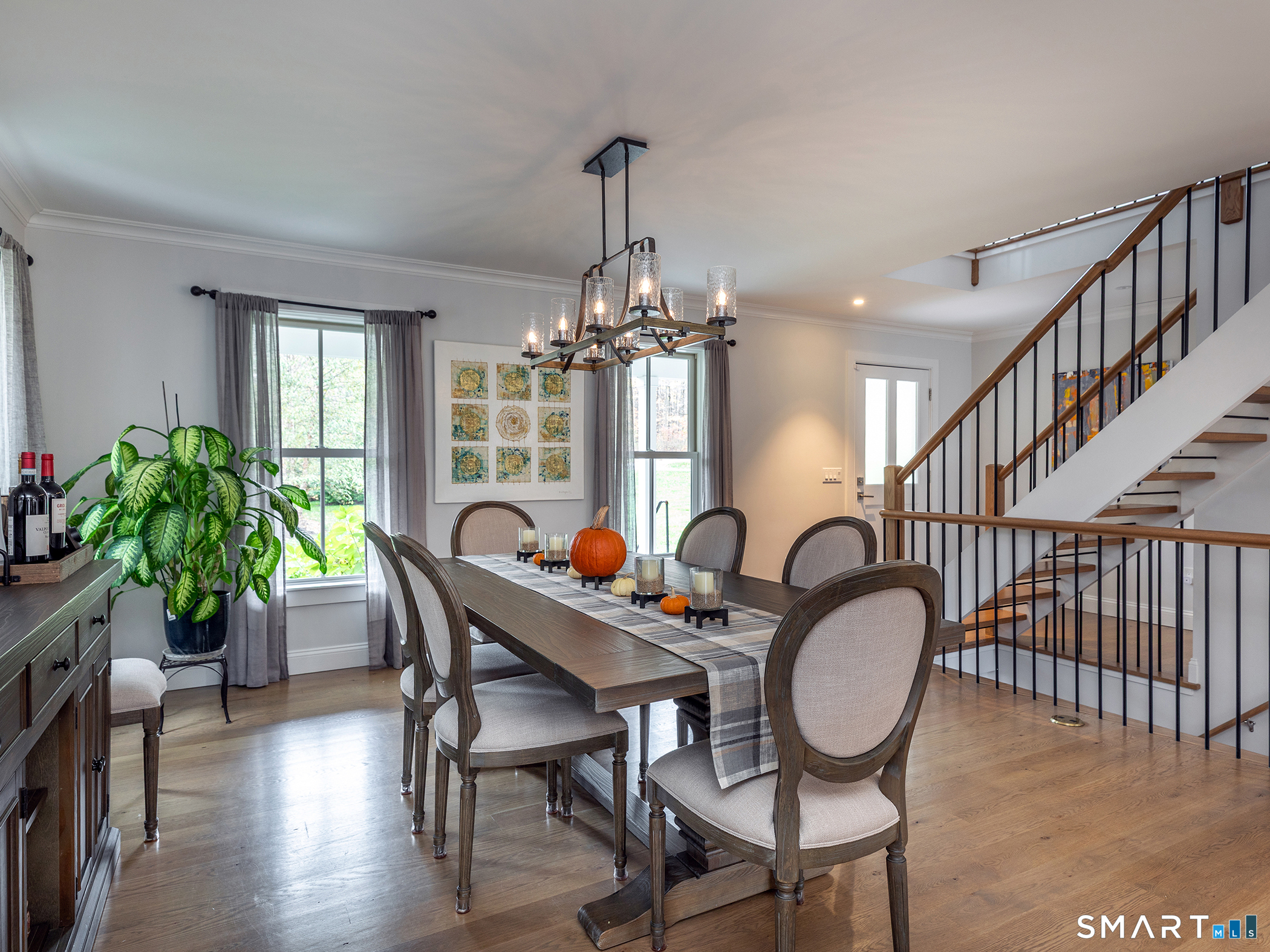 67 Sunset Lane Washington, CT 06794 - Photo 15 of 31 a dining room with furniture a chandelier and wooden floor