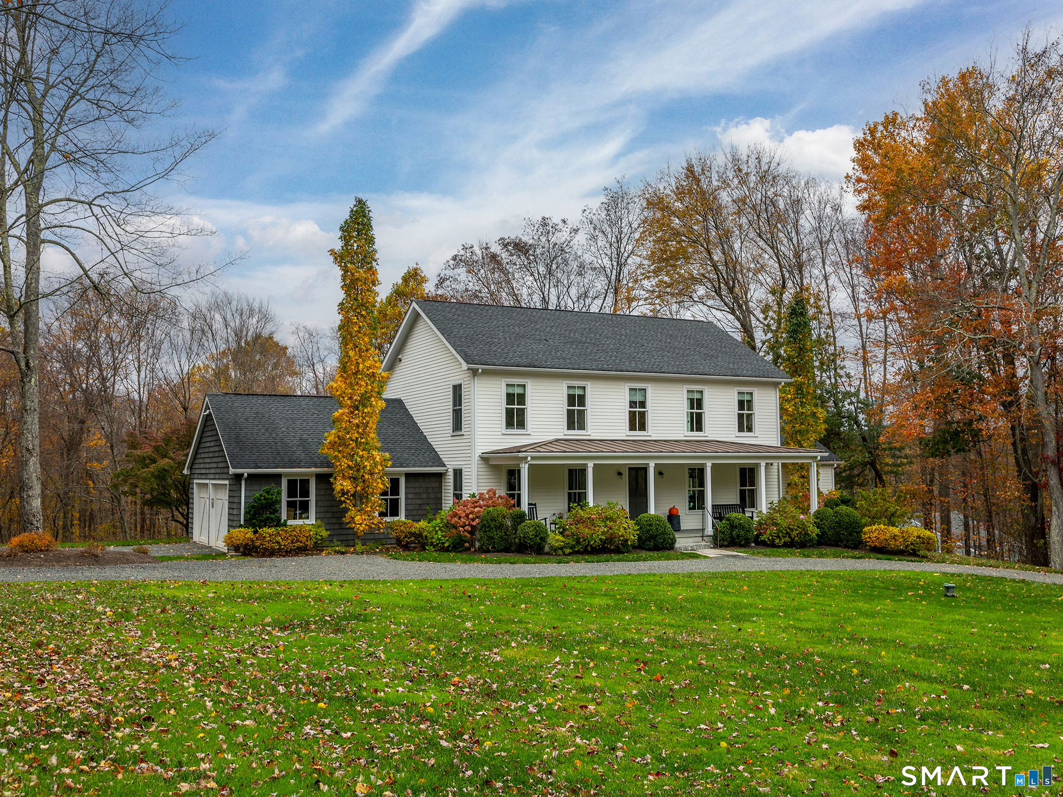 67 Sunset Lane Washington, CT 06794 - Photo 2 of 31 a front view of a house with a yard