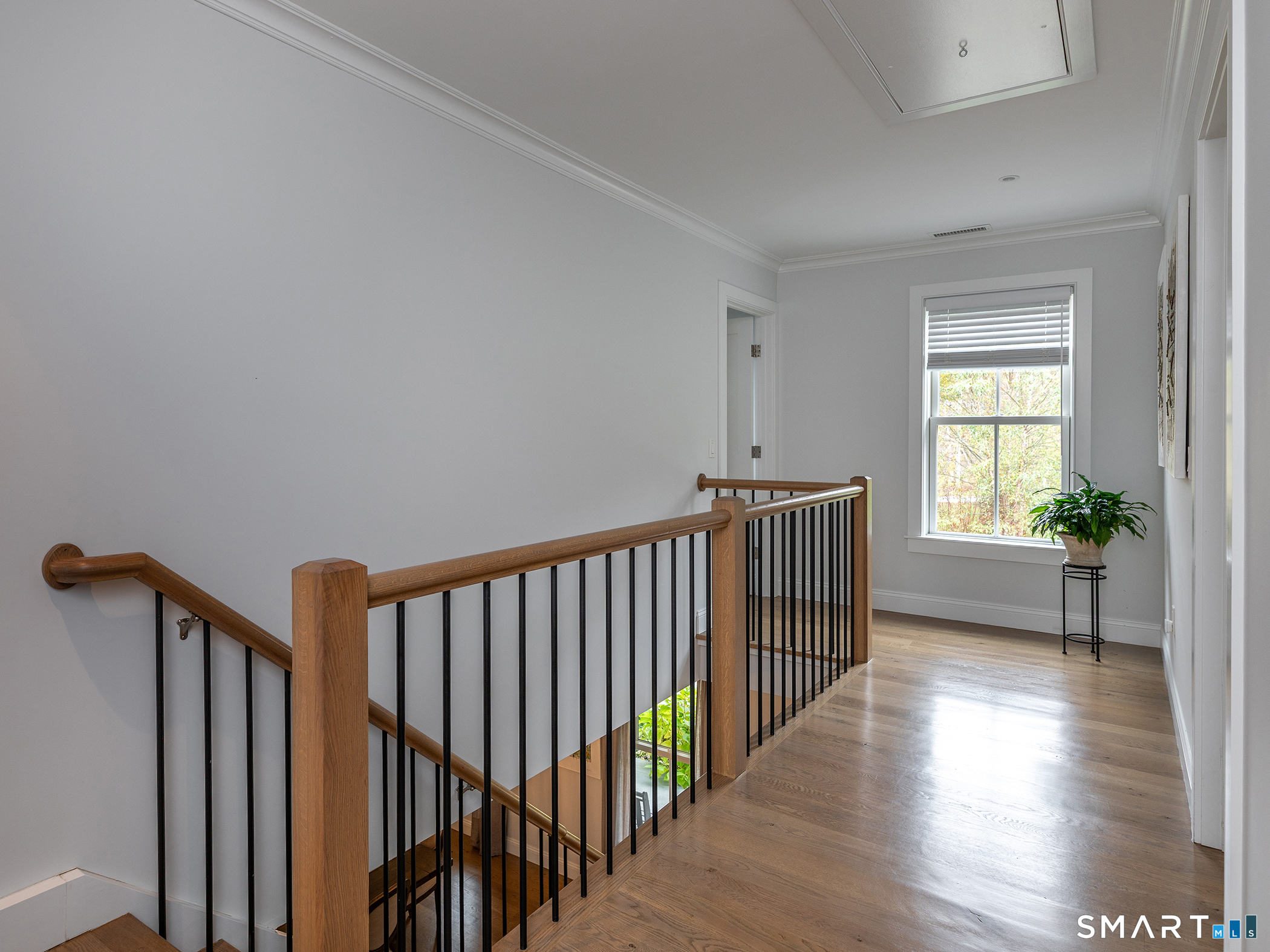 67 Sunset Lane Washington, CT 06794 - Photo 21 of 31 a view of hallway with wooden floor and stairs