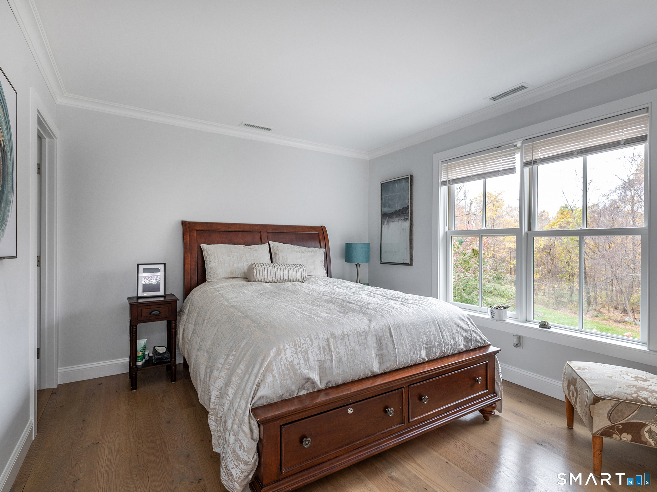 67 Sunset Lane Washington, CT 06794 - Photo 26 of 31 a bed sitting in a bedroom next to a window