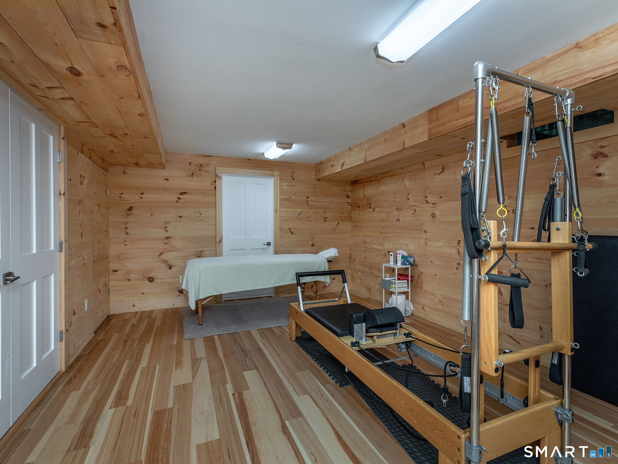 67 Sunset Lane Washington, CT 06794 - Photo 29 of 31 a room with wooden floor and furniture