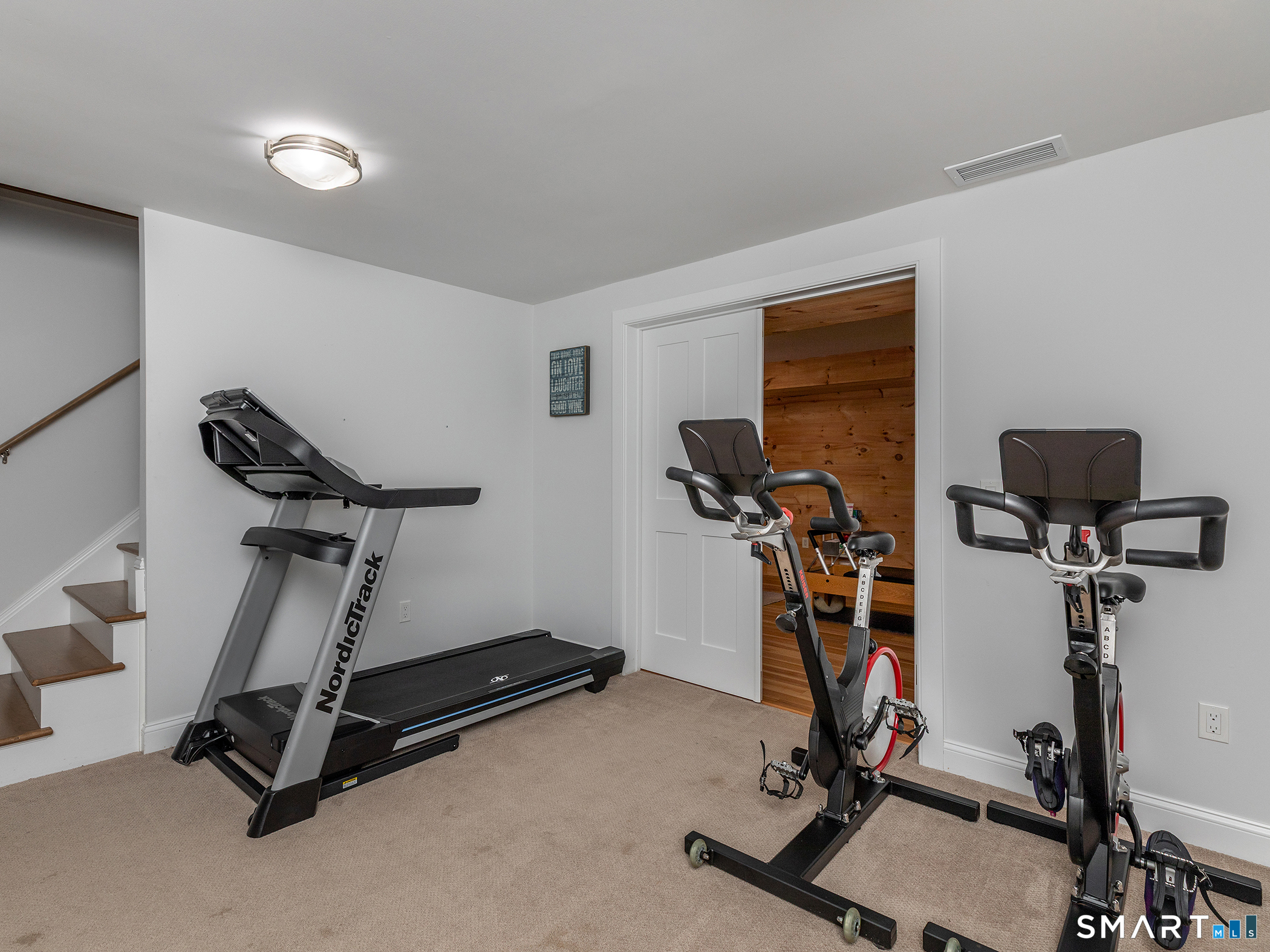 67 Sunset Lane Washington, CT 06794 - Photo 30 of 31 a room with gym equipment and windows