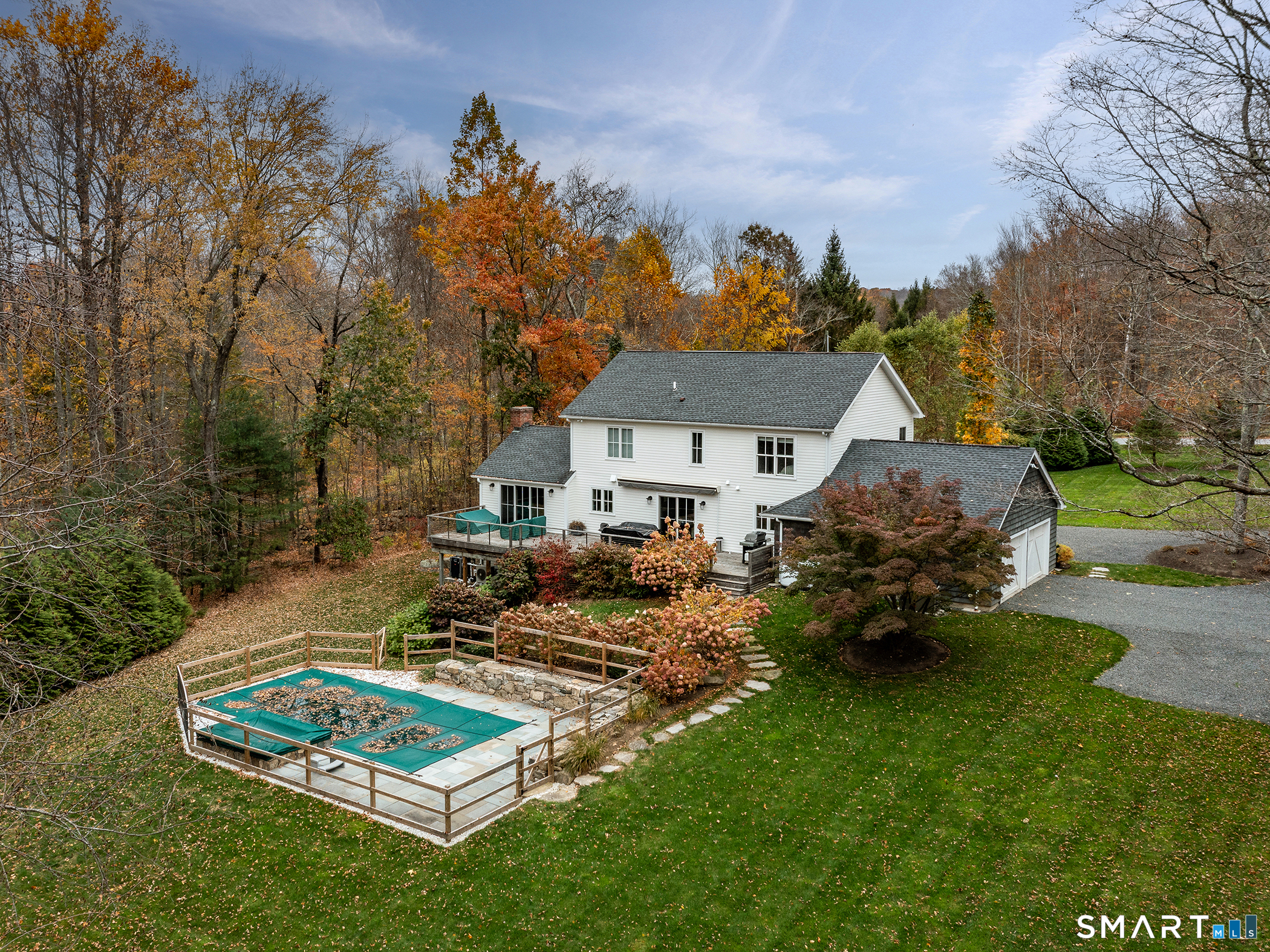 67 Sunset Lane Washington, CT 06794 - Photo 3 of 31 a view of a house with backyard patio and fire pit