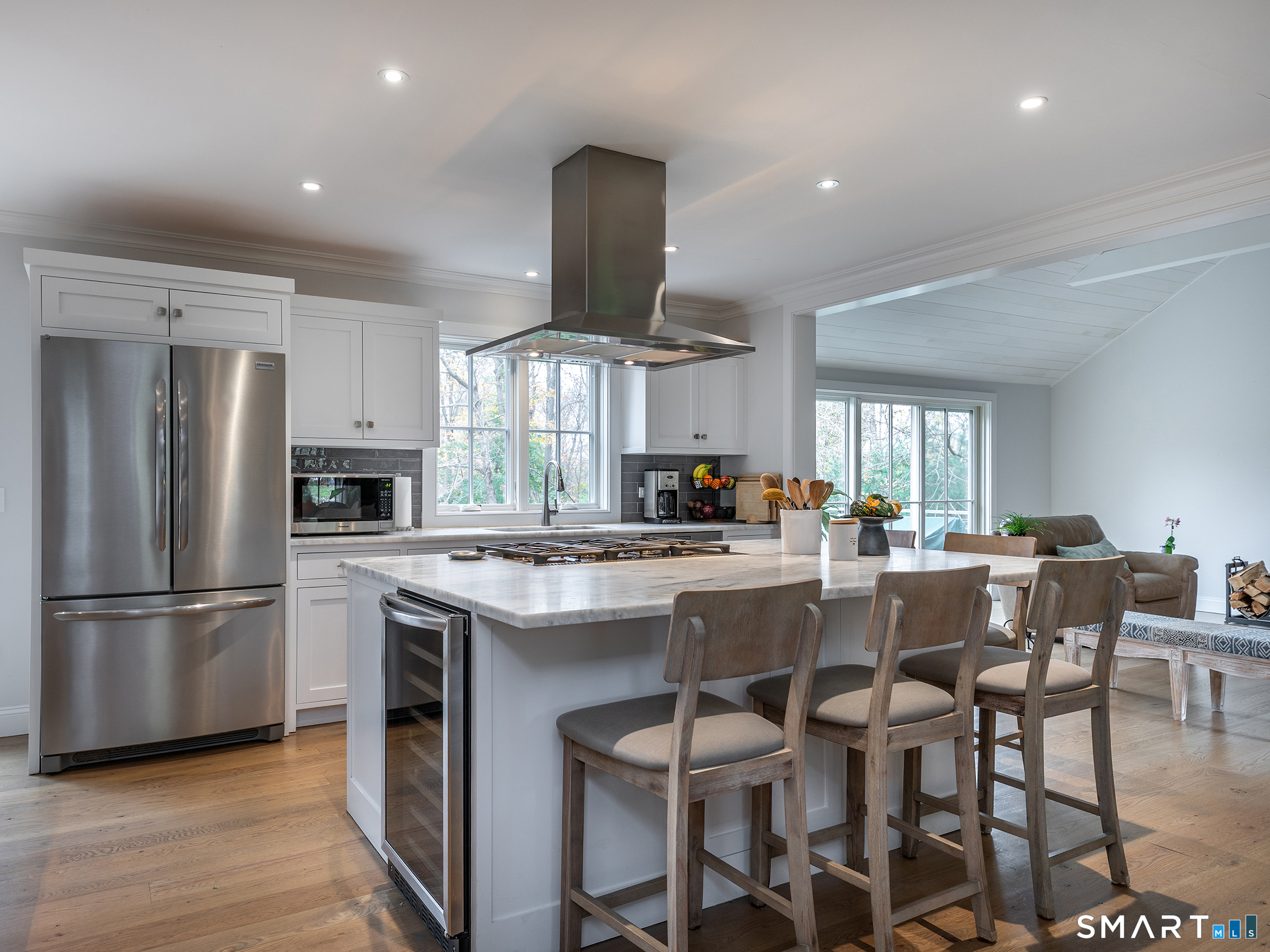 67 Sunset Lane Washington, CT 06794 - Photo 8 of 31 a kitchen with stainless steel appliances a dining table chairs stove and refrigerator