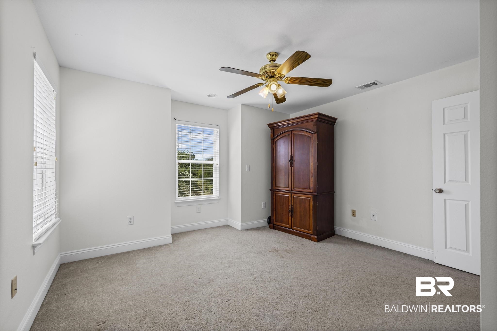 32875 Faircloth Road Lillian, AL 36549 - Photo 50 of 85 Unfurnished bedroom featuring light carpet and ceiling fan
