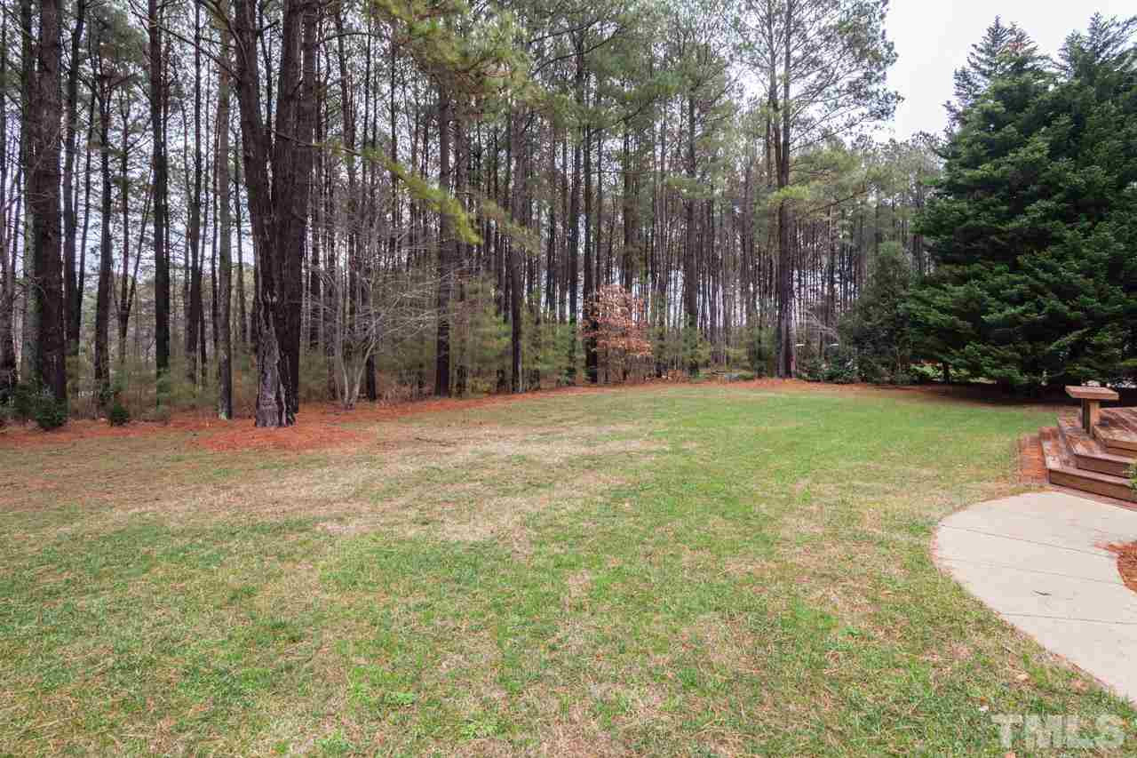 3709 White Chapel Way Raleigh, NC 27614 - Photo 20 of 25 The large back yard is very flat and perfect for fun and games. There is a wooded buffer in the back of the home. A fence runs along the very back of the property. Back Yard