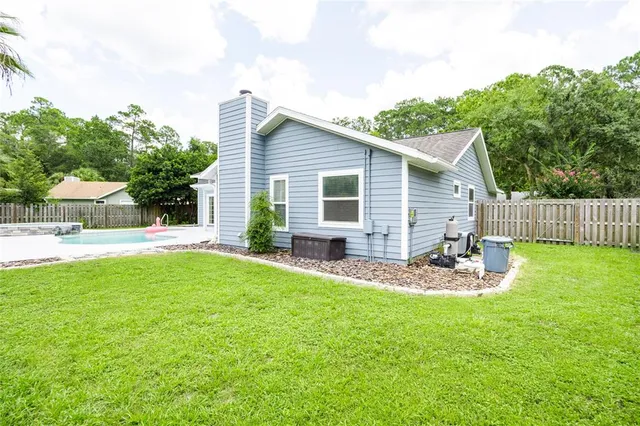 a house view with a backyard space