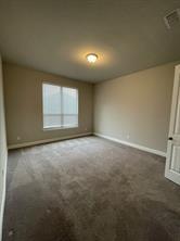 1913 Ridge Creek Lane Aubrey, TX 76227 - Photo 13 of 21 an empty room with a empty space and windows
