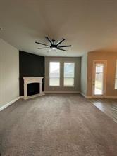 1913 Ridge Creek Lane Aubrey, TX 76227 - Photo 15 of 21 an empty room with a fireplace and windows