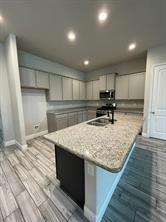 1913 Ridge Creek Lane Aubrey, TX 76227 - Photo 17 of 21 a kitchen with kitchen island sink refrigerator and white cabinets