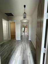 1913 Ridge Creek Lane Aubrey, TX 76227 - Photo 20 of 21 a view of a hallway view with wooden floor