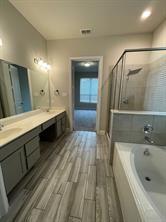 1913 Ridge Creek Lane Aubrey, TX 76227 - Photo 7 of 21 a bathroom with a tub sink and mirror