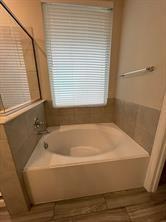 1913 Ridge Creek Lane Aubrey, TX 76227 - Photo 9 of 21 a bathroom with a bathtub