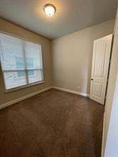1913 Ridge Creek Lane Aubrey, TX 76227 - Photo 10 of 21 an empty room with a empty space and window