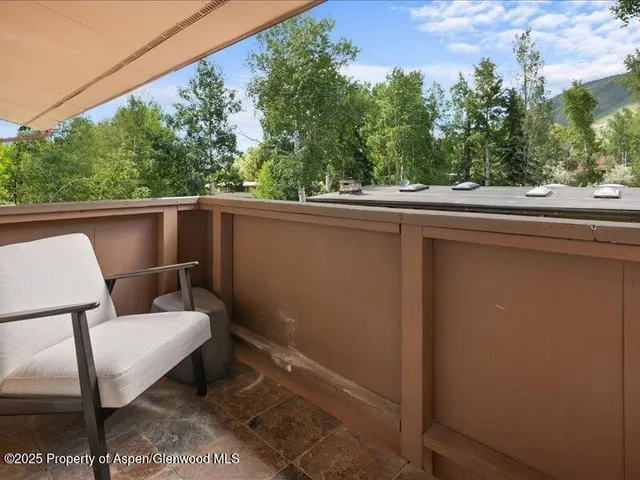a view of balcony with furniture