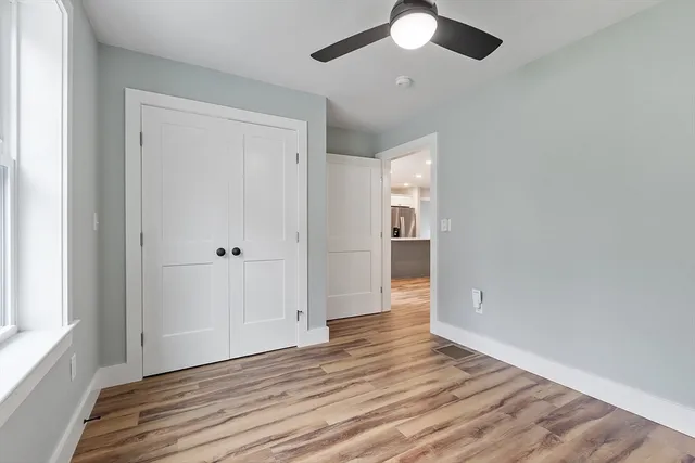 a bathroom with a sink mirror toilet and shower