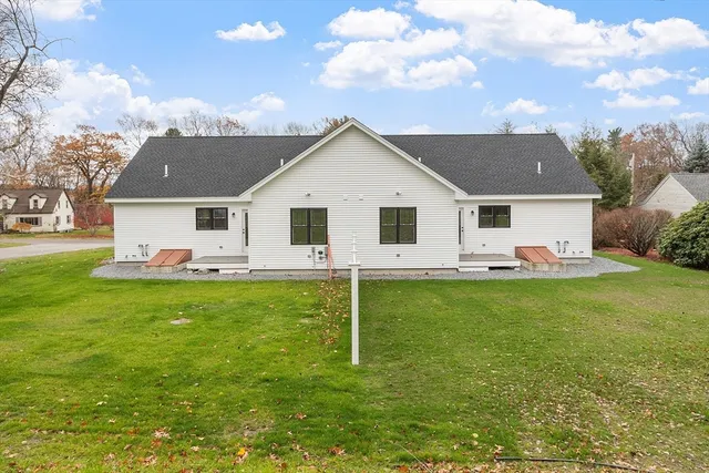 a view of a house with a backyard