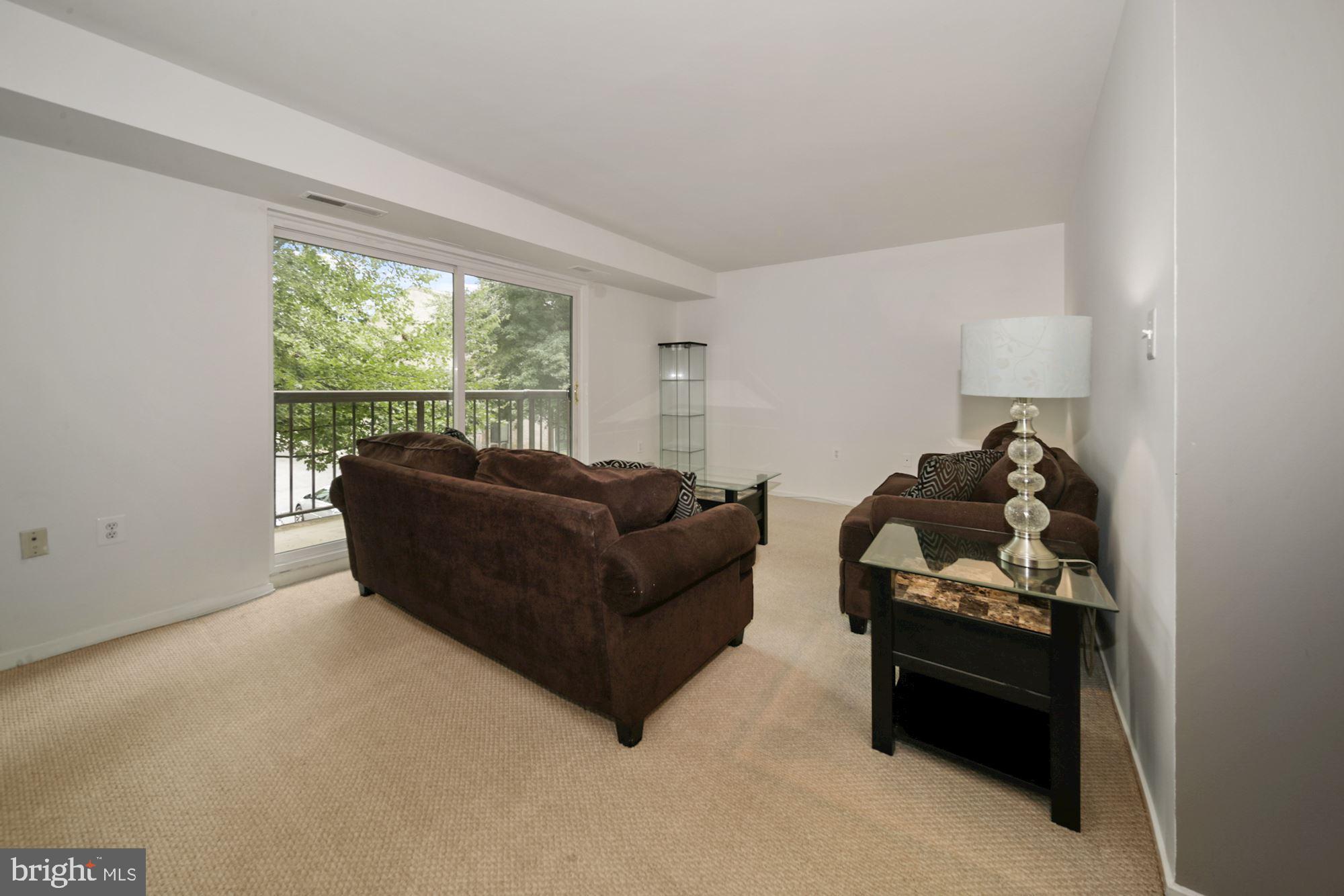 10026 Stedwick Road, Unit 204 Gaithersburg, MD 20886 - Photo 11 of 37 EZ Access to balcony, room to entertain LR