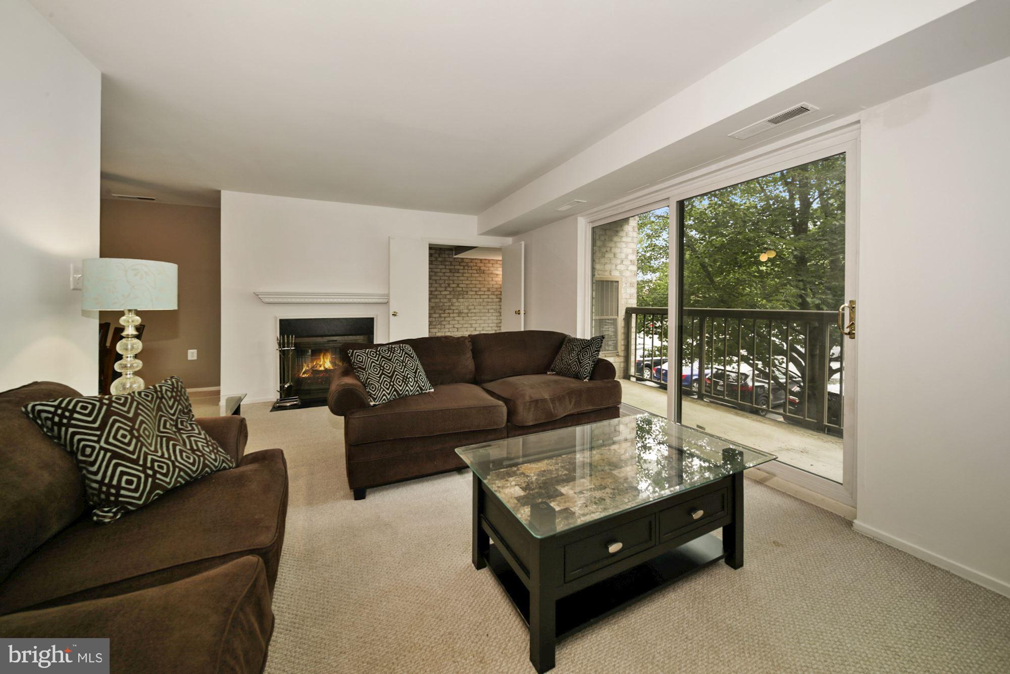 10026 Stedwick Road, Unit 204 Gaithersburg, MD 20886 - Photo 9 of 37 OPEN Living room w/ access to balcony