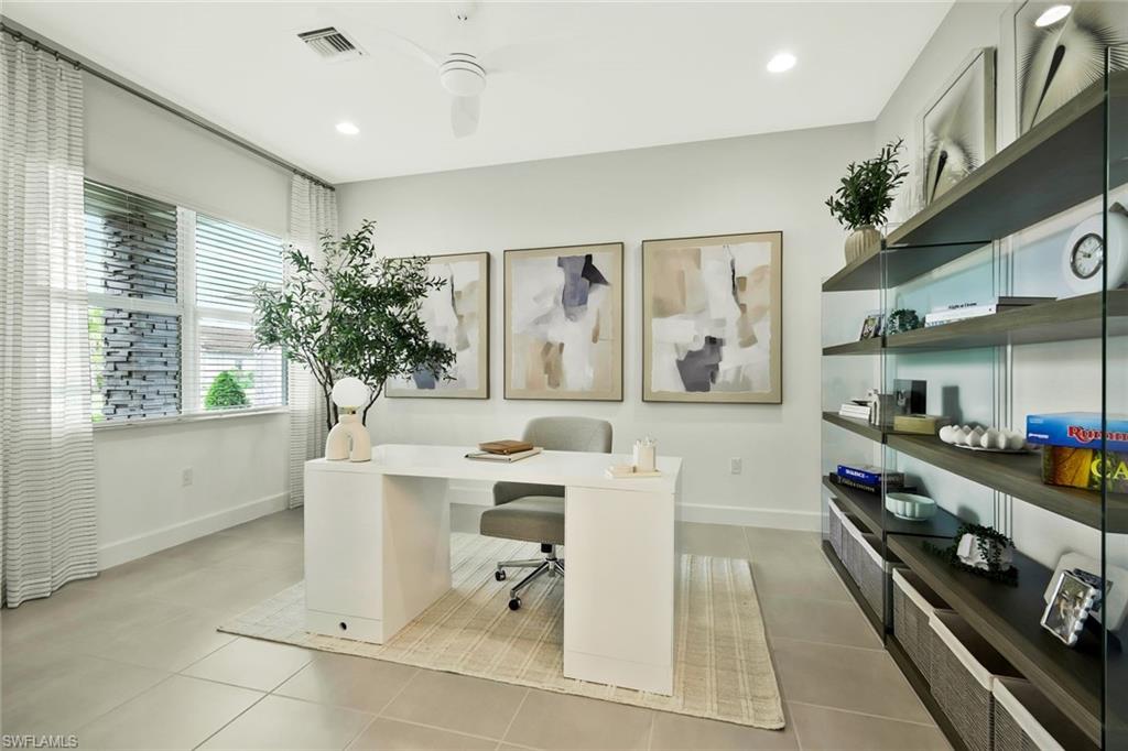 11805 Drake Lane Naples, FL 34120 - Photo 13 of 30 a kitchen with stainless steel appliances kitchen island granite countertop a sink and cabinets